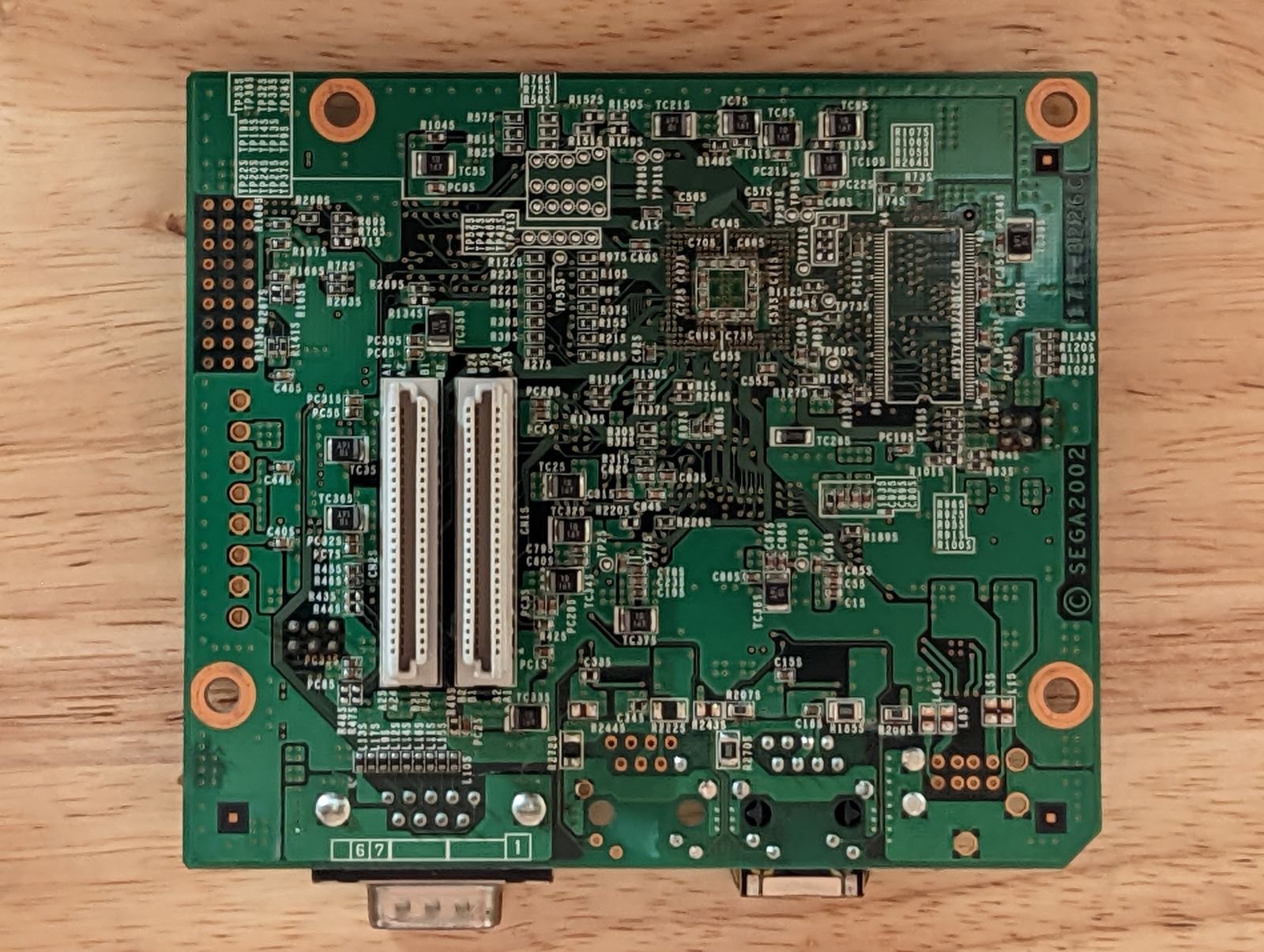 Photo of Triforce Type 3 network interface card, bottom view. There's two 50 pin connectors that connect the network interface card to the media board.