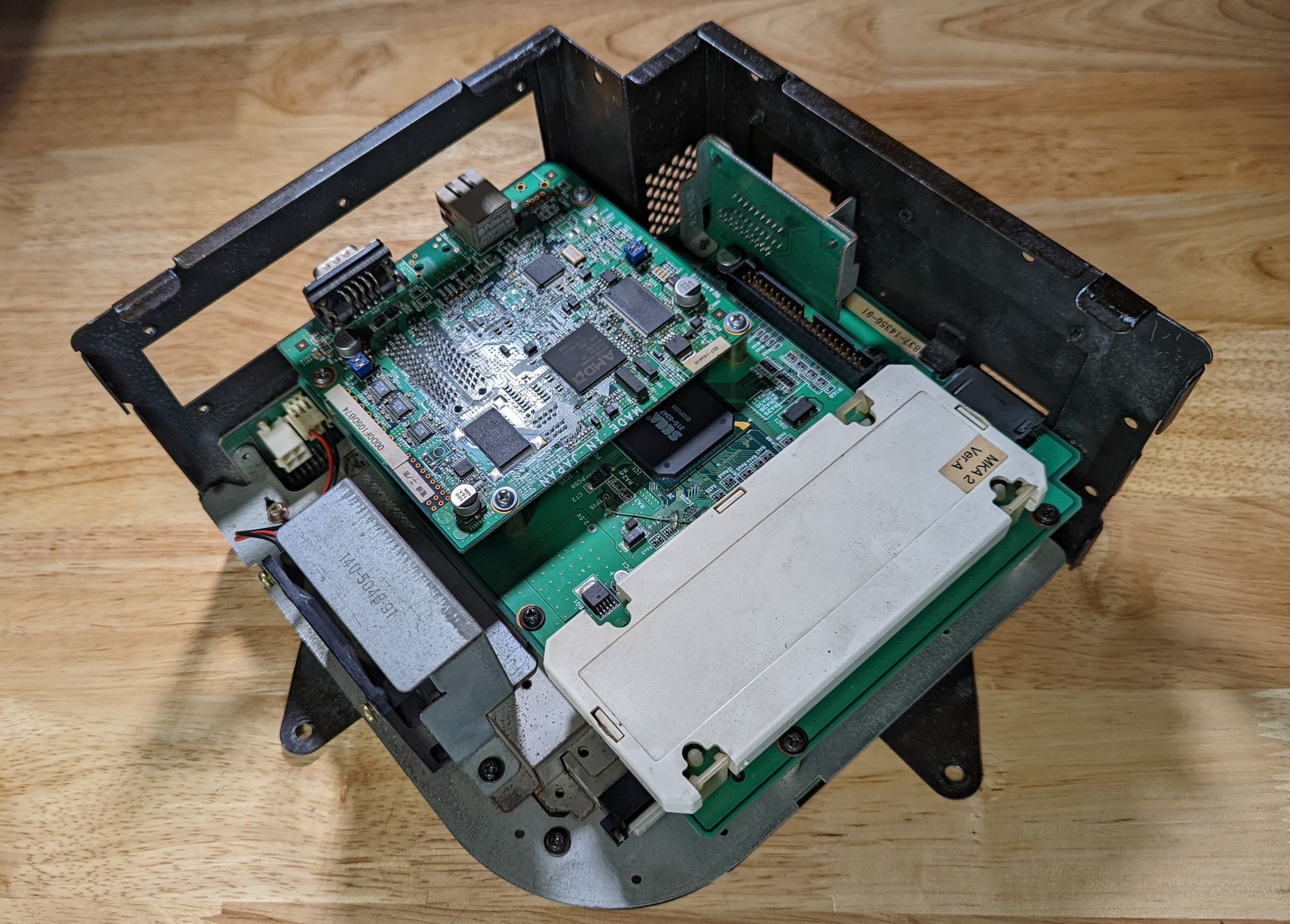A diagonal view of a Triforce Type-3 NAND unit with the cover removed.